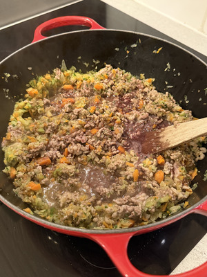 Deglazing Bolognese sauce with red wine