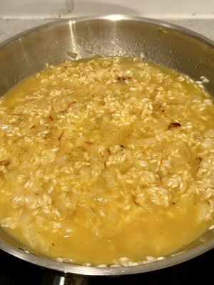 Creamy Milanese risotto with Parmesan and saffron, Italian recipe step 5