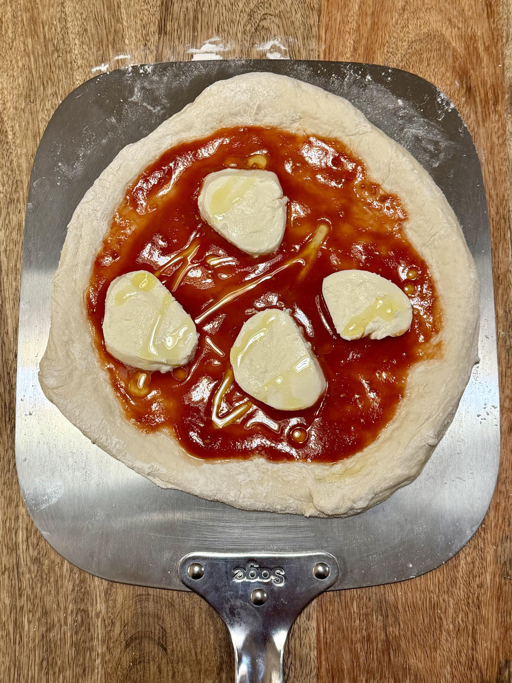 Neapolitan pizza dough stretching and baking technique